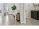Bright laundry room with washer, dryer, and built-in shelving at 10058 Shoreline View Way, Wesley Chapel, FL 33545