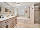 Elegant bathroom with double vanity, soaking tub, and walk-in shower at 1012 Osprey Ct, Tarpon Springs, FL 34689