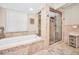 Bathroom with soaking tub and walk-in shower at 1012 Osprey Ct, Tarpon Springs, FL 34689