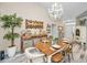 Farmhouse-style dining room with rustic wooden table and chandelier at 1012 Osprey Ct, Tarpon Springs, FL 34689