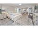 Main bedroom with king-size bed and access to a smaller bedroom at 1012 Osprey Ct, Tarpon Springs, FL 34689