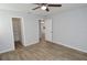 Bedroom with wood-look floors and access to closet and kitchen at 10265 Gandy N Blvd # 705, St Petersburg, FL 33702