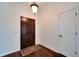 Bright entryway with hardwood floors and a dark door at 12006 Stone Crossing Circle, Tampa, FL 33635