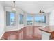 Bright living room with hardwood floors and expansive windows offering city views at 1209 E Cumberland Ave # 805, Tampa, FL 33602