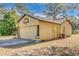 Attached garage with extra storage space at 14140 Oakwood Dr, Hudson, FL 34669