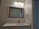 Bathroom features a vanity with a quartz countertop and a large mirror at 1644 24Th N Ave, St Petersburg, FL 33713