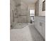 Updated bathroom with walk-in shower, grab bars, and modern vanity at 1644 24Th N Ave, St Petersburg, FL 33713