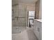 Updated bathroom with walk-in shower, grab bars, and modern vanity at 1644 24Th N Ave, St Petersburg, FL 33713