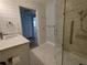 Updated bathroom with walk-in shower and modern vanity at 1644 24Th N Ave, St Petersburg, FL 33713