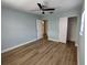 Bright bedroom with light blue walls and wood-look floors at 1644 24Th N Ave, St Petersburg, FL 33713