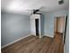 Spacious bedroom with neutral walls, wood-look floors, and a large closet at 1644 24Th N Ave, St Petersburg, FL 33713
