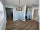 Bright dining area with wood-look floors and modern light fixture at 1644 24Th N Ave, St Petersburg, FL 33713