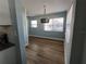 Bright dining area with wood-look floors and modern light fixture at 1644 24Th N Ave, St Petersburg, FL 33713