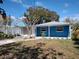 Charming blue house with a spacious yard and driveway at 1644 24Th N Ave, St Petersburg, FL 33713