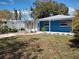 Blue house with a white fence and a spacious yard at 1644 24Th N Ave, St Petersburg, FL 33713