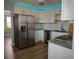 Modern kitchen featuring stainless steel appliances and white cabinets at 1644 24Th N Ave, St Petersburg, FL 33713