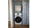 Bright laundry room with washer, dryer, and storage cabinets at 1644 24Th N Ave, St Petersburg, FL 33713