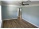 Living room with light-blue walls and wood-look flooring at 1644 24Th N Ave, St Petersburg, FL 33713