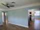 Living room with light-blue walls and wood-look flooring at 1644 24Th N Ave, St Petersburg, FL 33713