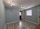 Spare bedroom with light blue walls and wood-look floors at 1644 24Th N Ave, St Petersburg, FL 33713