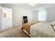 Bedroom featuring carpeted floors, a bed with an orange blanket, and a TV at 17209 Sabrina Cir, Port Charlotte, FL 33948