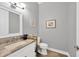 Powder room with granite countertop and wood flooring at 1901 25Th N Ave, St Petersburg, FL 33713