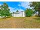 Backyard with a privacy fence and grassy area at 2579 Forest Run Ct, Clearwater, FL 33761