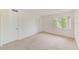 Spacious bedroom featuring a large window and built-in closet at 2579 Forest Run Ct, Clearwater, FL 33761