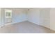 Well-lit bedroom with access to a full bathroom and double closets at 2579 Forest Run Ct, Clearwater, FL 33761