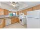 Bright kitchen with ample wood cabinets and granite countertops at 2579 Forest Run Ct, Clearwater, FL 33761