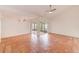 Bright living room with tile floors and access to a screened patio at 2579 Forest Run Ct, Clearwater, FL 33761