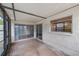 Screened porch with sliding glass doors and brick floor at 2579 Forest Run Ct, Clearwater, FL 33761