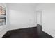 Simple bedroom with dark hardwood floors and access to another room at 2746 Via Tivoli # 135B, Clearwater, FL 33764