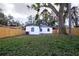 Newly renovated home with backyard and wooden fence at 3014 E Osborne Ave, Tampa, FL 33610