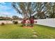 Landscaped backyard with water feature and plants at 3118 Partridge Point Trl, Valrico, FL 33596