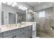 Elegant bathroom with double vanity and walk-in shower at 3192 Nautical S Pl, St Petersburg, FL 33712
