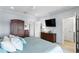 Spacious main bedroom with large armoire and TV at 3192 Nautical S Pl, St Petersburg, FL 33712