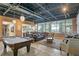 Relaxing common area with pool table, comfortable seating, and large windows at 3192 Nautical S Pl, St Petersburg, FL 33712