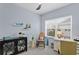 Bright home office features built-in shelving and a rocking chair at 3192 Nautical S Pl, St Petersburg, FL 33712