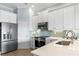 Stainless steel appliances and white cabinetry in kitchen at 3192 Nautical S Pl, St Petersburg, FL 33712