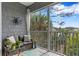 Relaxing screened lanai with gray wood-look decor, furniture and a view at 3192 Nautical S Pl, St Petersburg, FL 33712