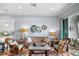 Living room with light walls, wicker armchairs, and a sofa at 3192 Nautical S Pl, St Petersburg, FL 33712