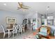 Bright living room area featuring dining table, staircase and bar area at 3192 Nautical S Pl, St Petersburg, FL 33712