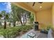 Covered patio with grill, seating, and lake view at 3192 Nautical S Pl, St Petersburg, FL 33712