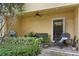 Relaxing covered patio with seating, grill, and lush landscaping at 3192 Nautical S Pl, St Petersburg, FL 33712