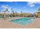 Inviting pool area with lounge chairs and tiki huts at 3192 Nautical S Pl, St Petersburg, FL 33712