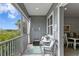 Relaxing screened balcony with wicker furniture and scenic view at 3192 Nautical S Pl, St Petersburg, FL 33712