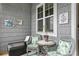 Cozy balcony with wicker chairs and a small table at 3192 Nautical S Pl, St Petersburg, FL 33712