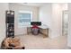 Bright home office features a corner desk, built-in shelving, and comfortable seating at 3345 Pleasant Willow Ct, Brandon, FL 33511