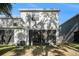 Rear view of the house showing a screened patio and AC unit at 3345 Pleasant Willow Ct, Brandon, FL 33511